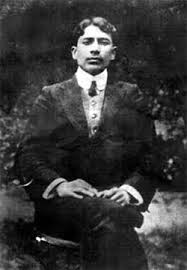 Small black and white reproduction of the seated photograph of Madan Lal Dhingra.